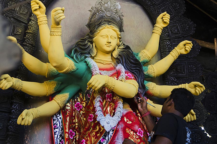 Artist gets-ready to-paint idols of Durga-Statues on-Durga puja festival