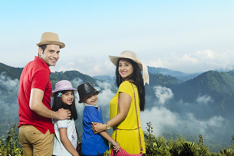 Happy-Family Parents With Two-Children views of-the valley-Mountains in ...