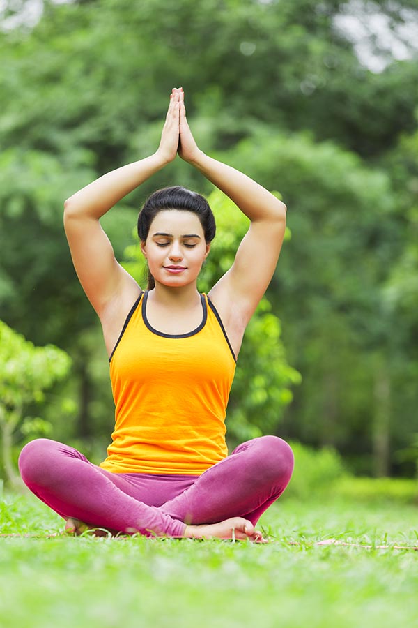 Indian Young-Woman Sitting On-Grass Doing Yoga Surya-Namaskar ...