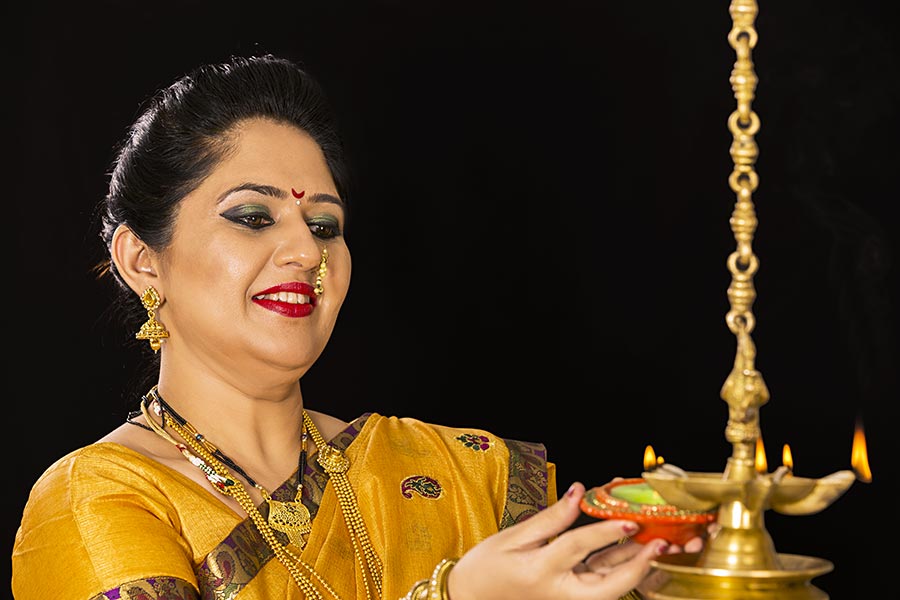 Traditional Indian Marathi Woman Diwali Celebrating Burning-Diya With ...