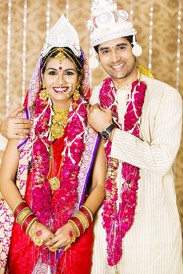 Indian bride and groom in traditional wedding dress Bengali Wedding Ceremony