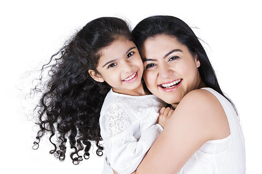 Happy Indian mother and Little daughter hugging Love Fun Cheerful