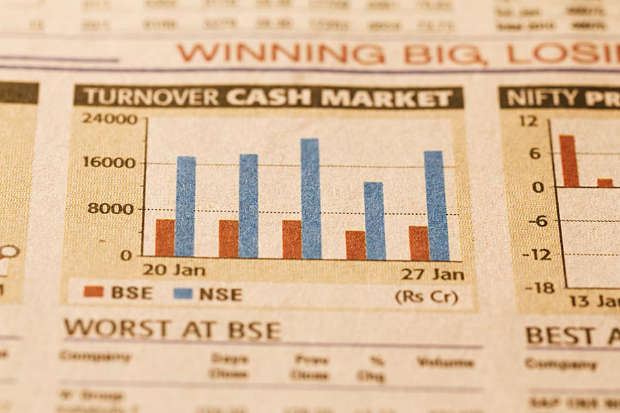 Bar graphs on a financial newspaper stock market concept