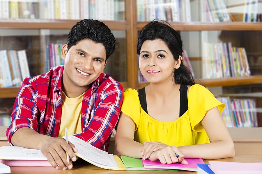 Indian Couple College Student Reading Book Studying Library Exam Preparing