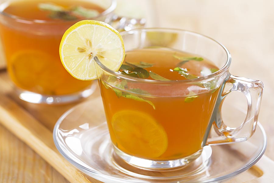 nobody-shot-close-up-drinking-lemon-herbal-tea-health-benefits-purity