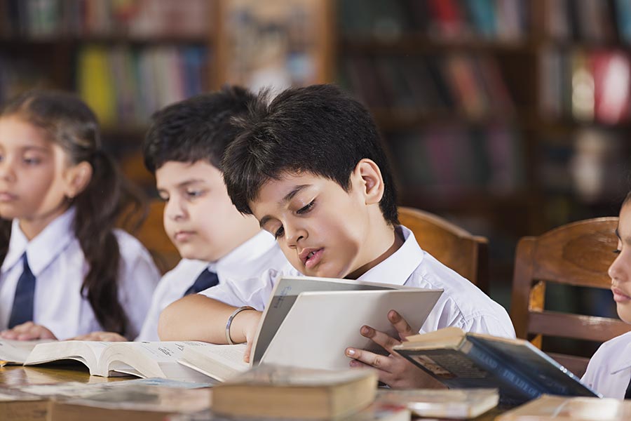 Indian School Kids Friends Students Reading Book Studying Education In