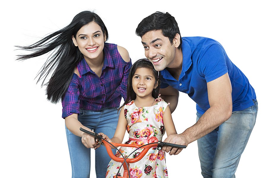 indian-parents-teaching-kid-daughter-to-ride-cycle-fun-enjoy