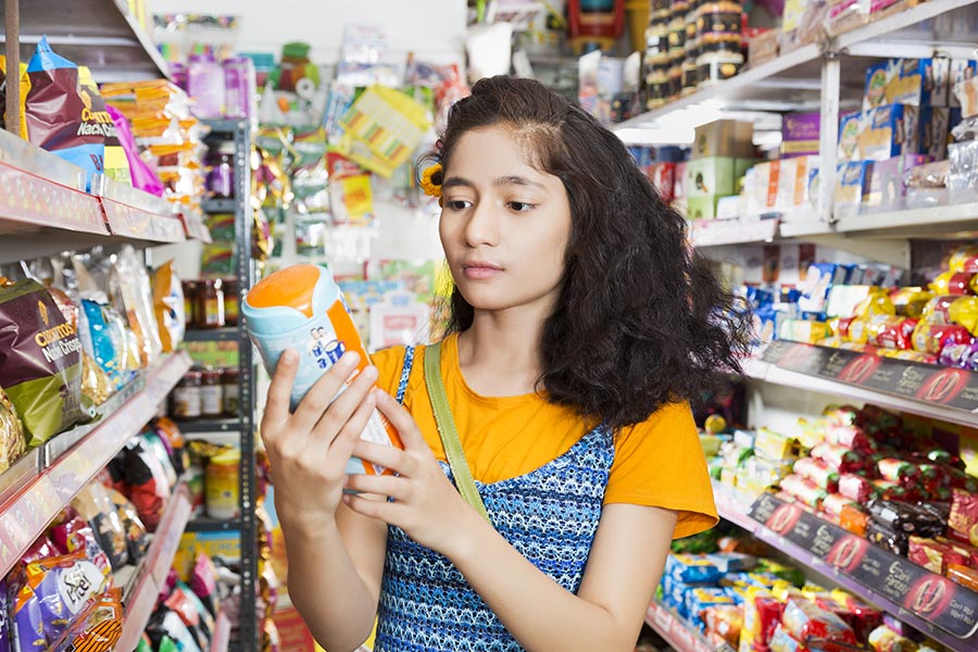 Indian Teenager Girl Doing Shopping Checking Price Malted-Food Grocery ...