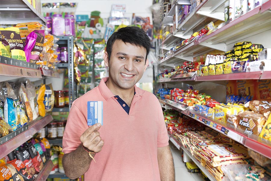 Indian Adult-male Doing Grocery Shopping Showing Credit-card In Grocery ...