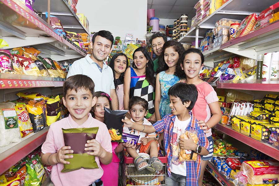 Indian Big-Family Parents And Kids Together Doing Grocery Shopping In ...