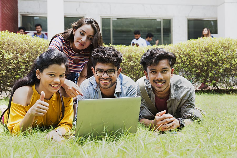 College Students Friends Together Showing Thumbs-up With laptop ...