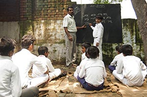 40-50 Years ; Adult Man ; Alphabet ; Blackboard ; 