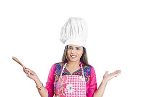 Lady Holding kitchen Utensil