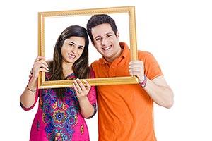 Couple Holding Picture Frame