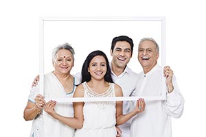 Happy Indian Family Holding Frame