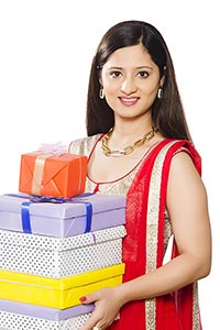 Indian Woman Stack Gift Boxes Diwali Celebration