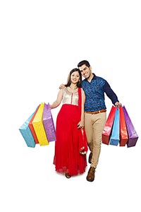 Happy Indian Couple Shopping Bags Walking
