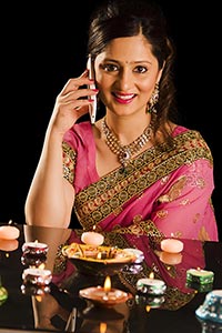 Woman Diyas Stack Talking phone Diwali