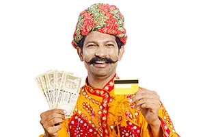 Gujrati Man Showing Money Credit card
