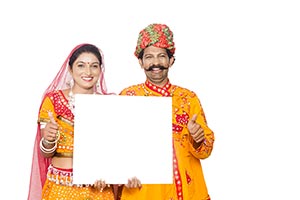 Gujrati Couple Showing Whiteboard