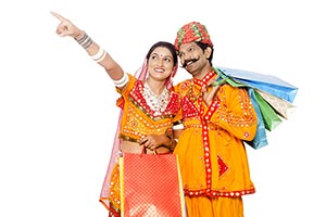 Gujrati Couple Shopping Bags Pointing