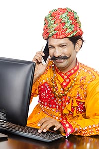 Gujrati Man Computer Talking Phone Multitasking