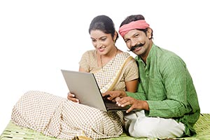 Indian Rural Couple Using Laptop