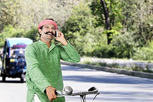 Rural Man Riding Bicycle Talking Phone