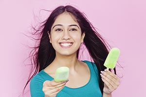 Young Woman Giving Ice cream
