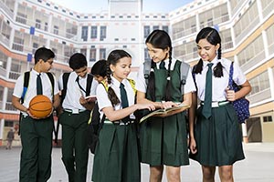 Bag ; Book ; Boys ; Buildings ; Carrying ; Classma